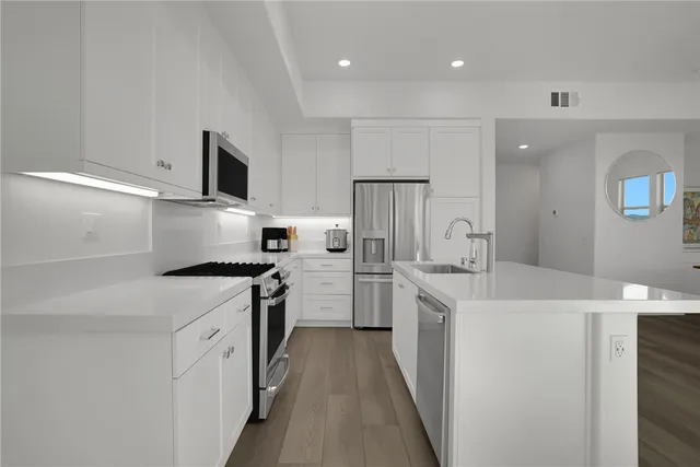 a dining room with a wooden table and chairs