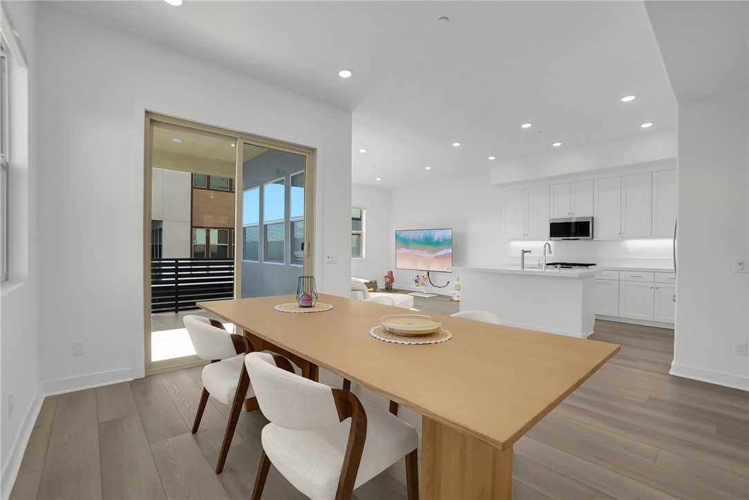 1958 Hollyleaf Terrace Montebello, CA 90640 - Photo 21 of 58 a kitchen with a table chairs and white cabinets