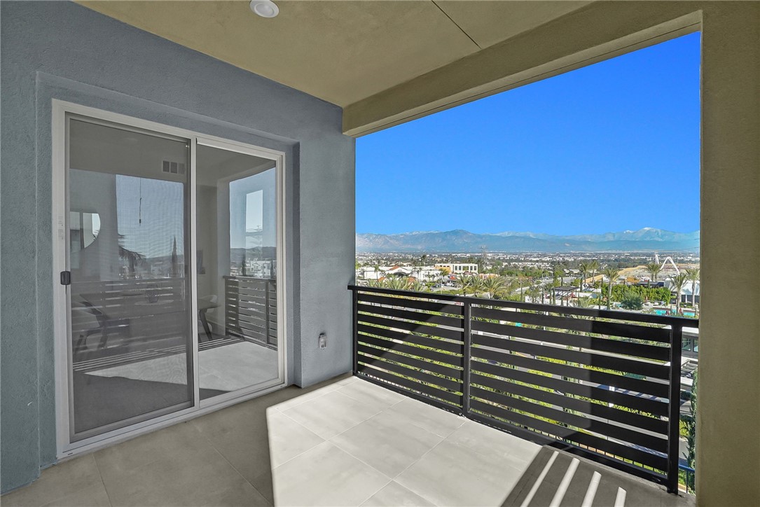 1958 Hollyleaf Terrace Montebello, CA 90640 - Photo 23 of 58 a view of a balcony with floor to ceiling windows and wooden floor