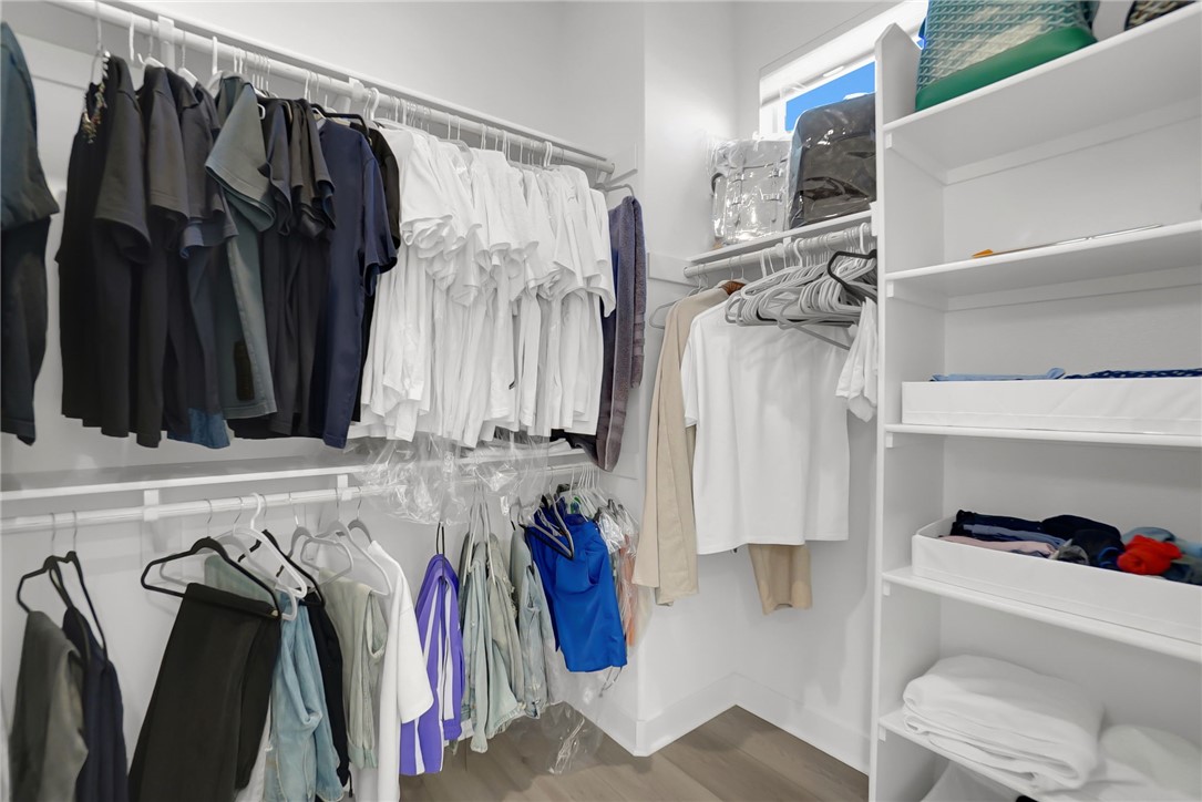 1958 Hollyleaf Terrace Montebello, CA 90640 - Photo 33 of 58 a view of walk in closet with clothes and shoes