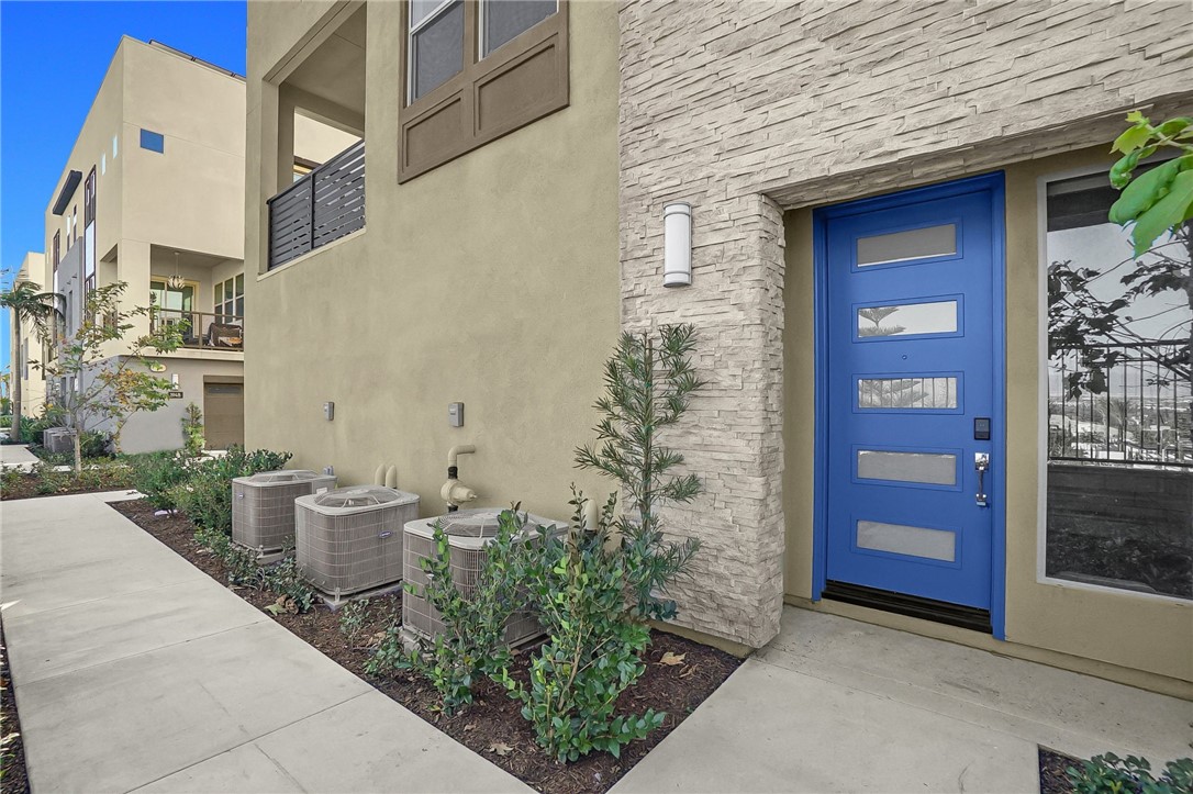 1958 Hollyleaf Terrace Montebello, CA 90640 - Photo 4 of 58 a view of a brick house with a bench and potted plants