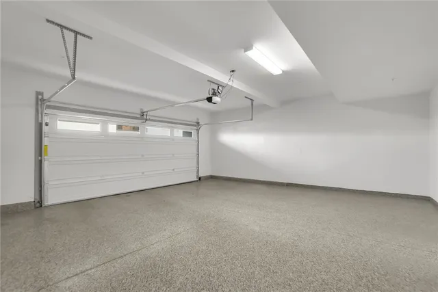 a view of a house with swimming pool and sitting area