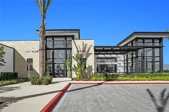 a view of a patio with a table chairs and a backyard