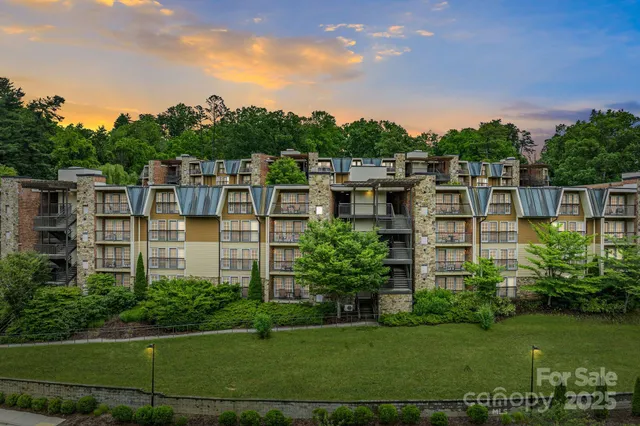 a view of a garden with a building in the background