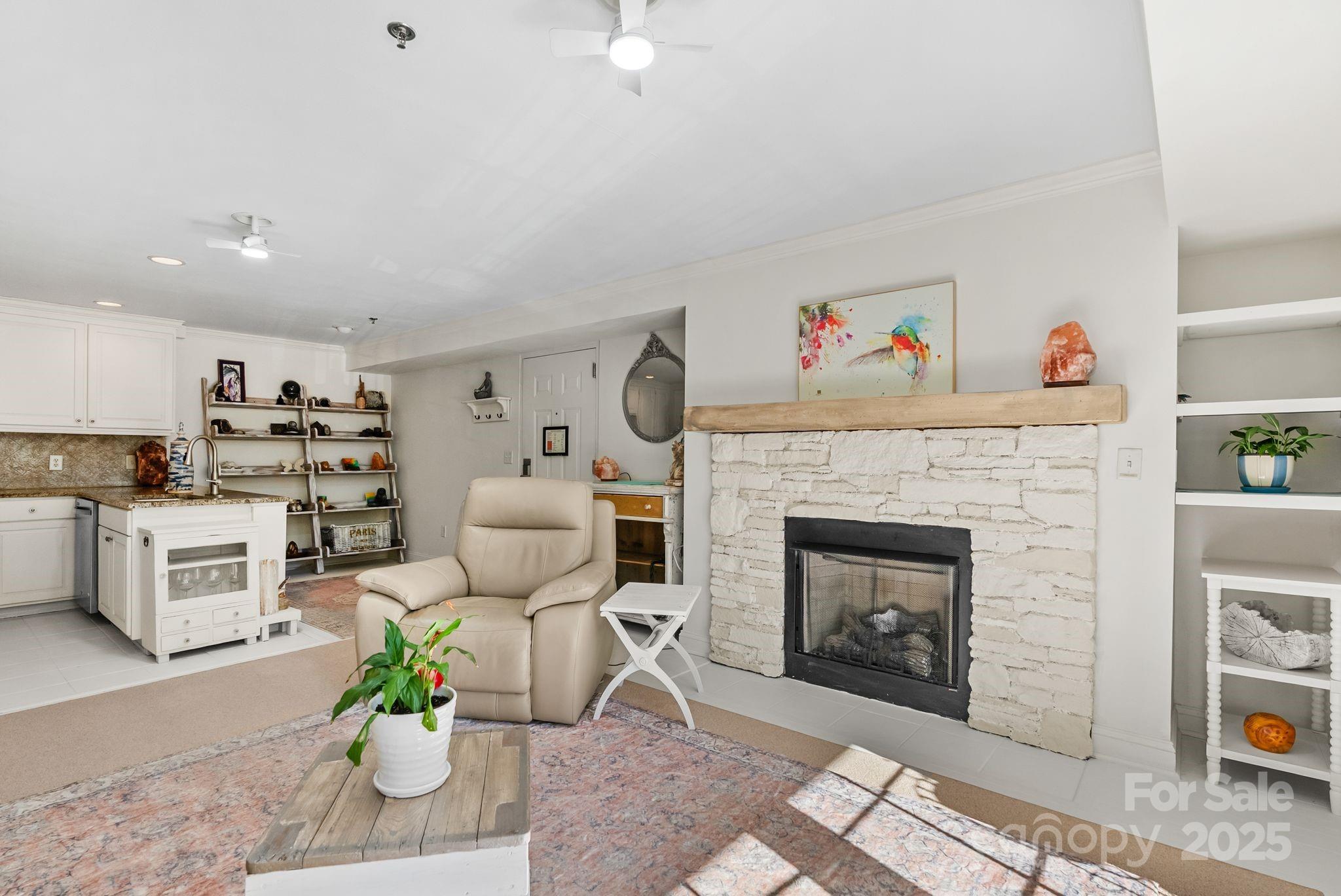 429 Bowling Park Road Asheville, NC 28803 - Photo 11 of 30 a living room with furniture and a fireplace