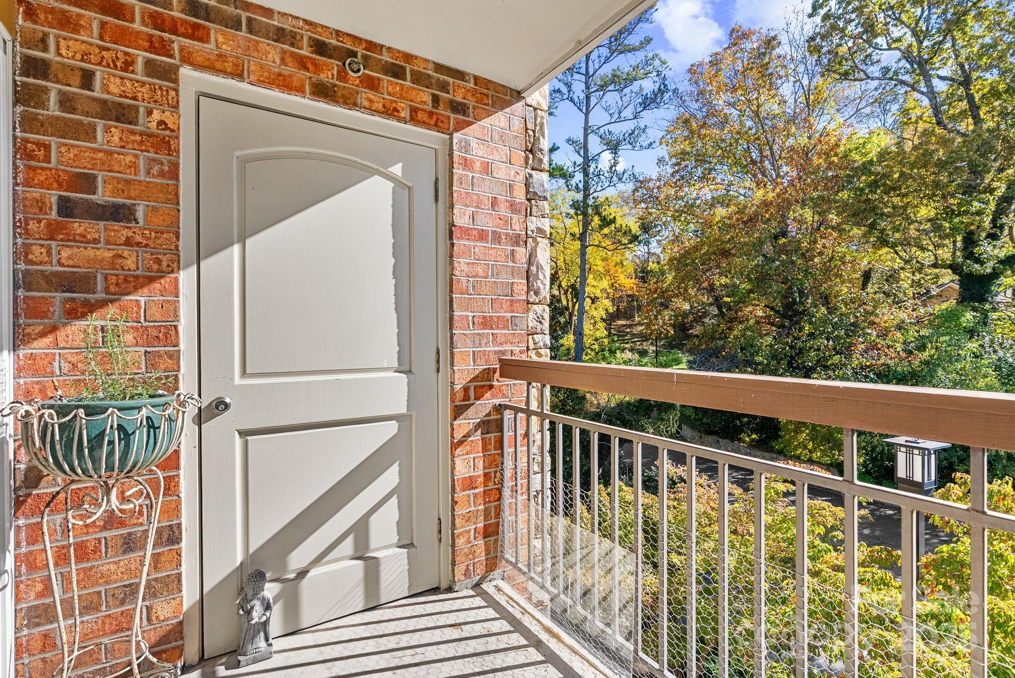 429 Bowling Park Road Asheville, NC 28803 - Photo 15 of 30 a view of balcony with wooden floor and fence