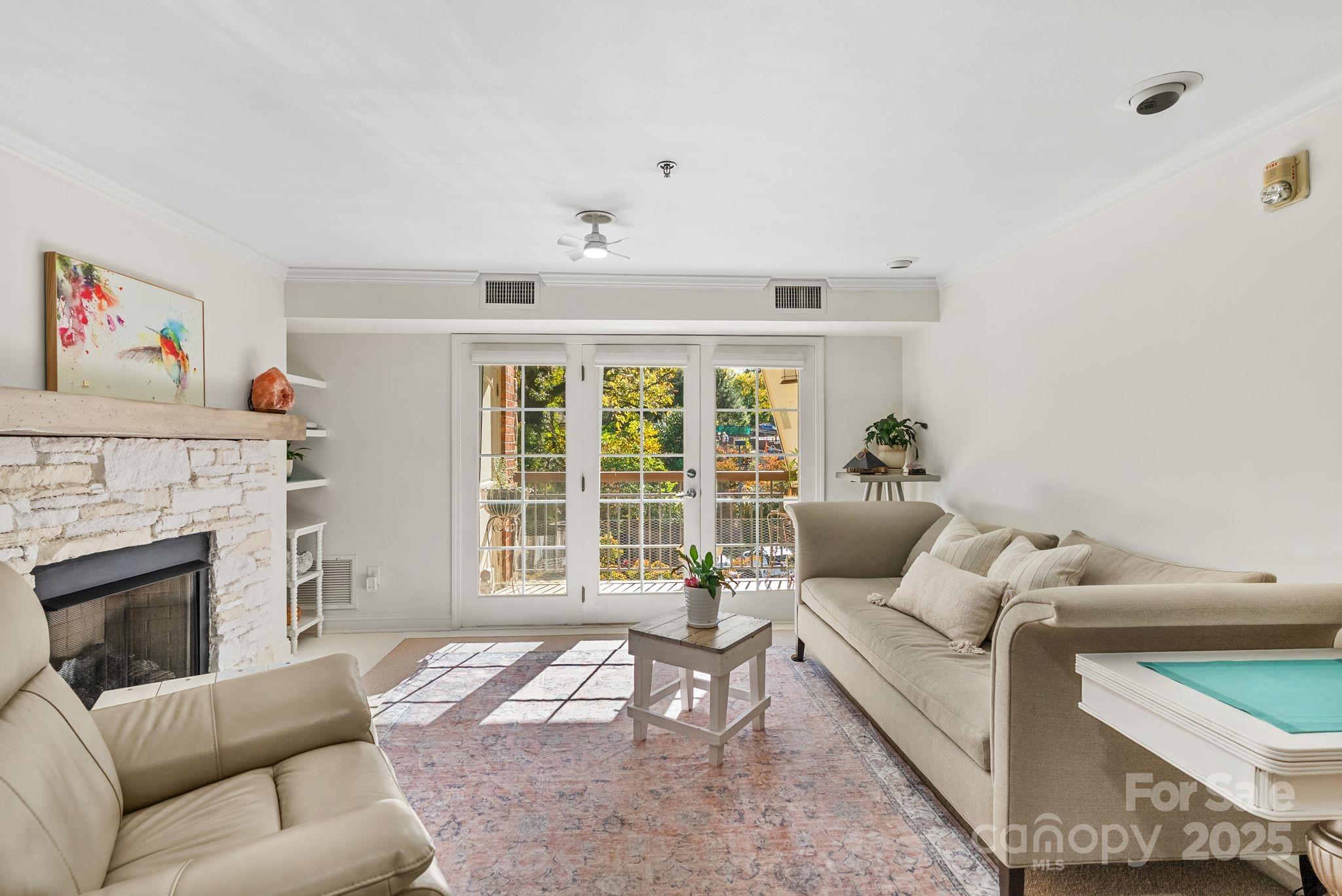 429 Bowling Park Road Asheville, NC 28803 - Photo 9 of 30 a living room with furniture and a fireplace