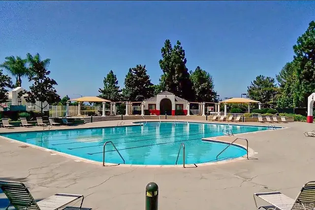 a view of a lake with houses in the back