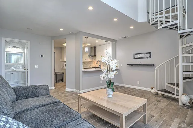 a kitchen with stainless steel appliances granite countertop a stove and cabinets