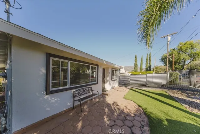a backyard of a house with a yard and garage