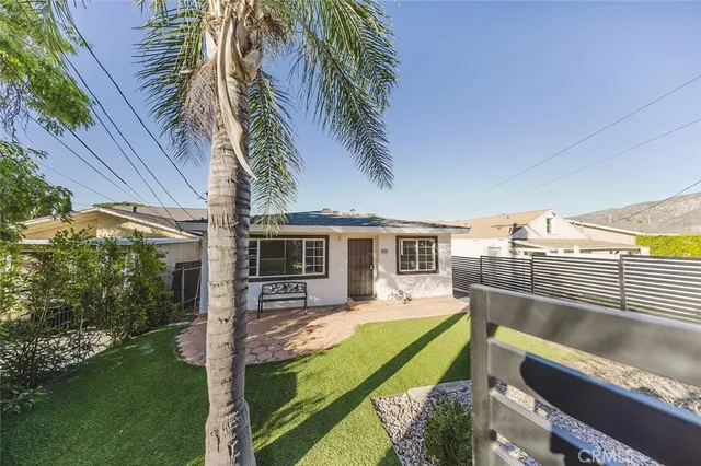 a view of swimming pool with a backyard and seating area