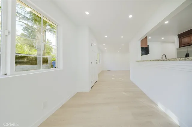 a view of a kitchen with a sink and a window