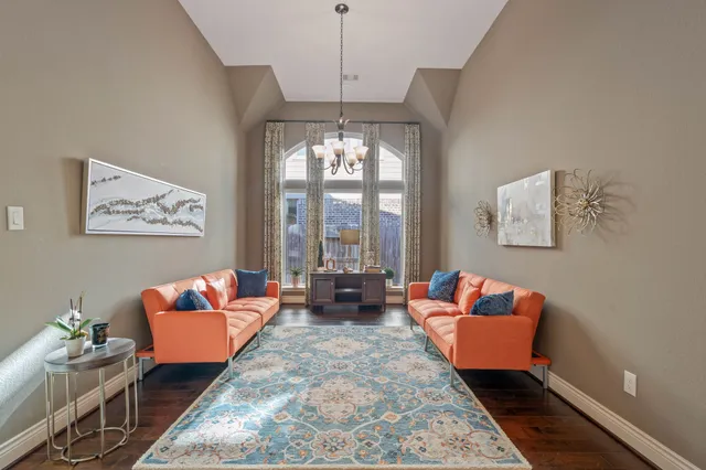 a living room with fireplace furniture and a flat screen tv