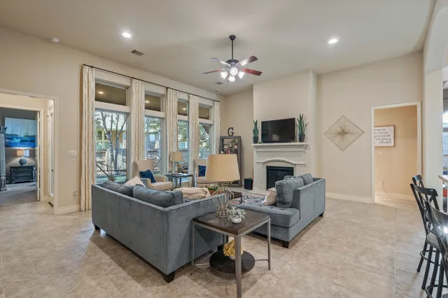 a living room with furniture and a large window