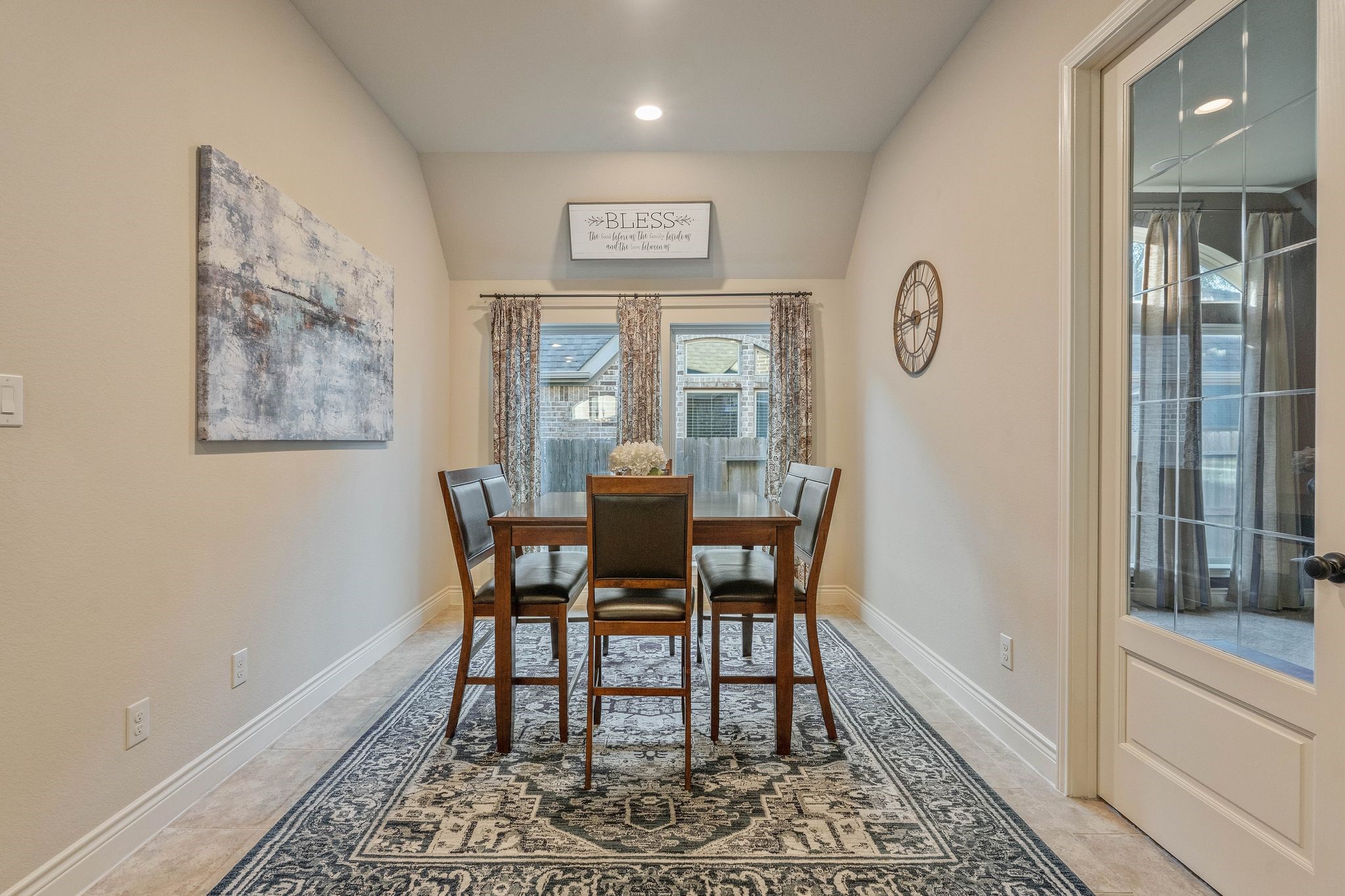 23306 Ridge Spring Drive New Caney, TX 77357 - Photo 18 of 45 a view of a dining room with furniture window and wooden floor