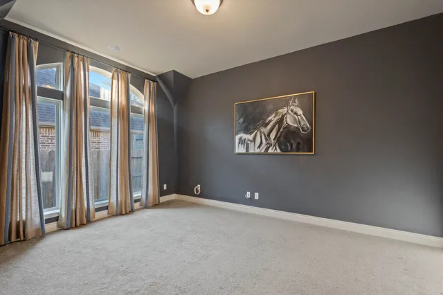 a bedroom with furniture and a window