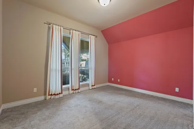 a living room with furniture a table and a large window