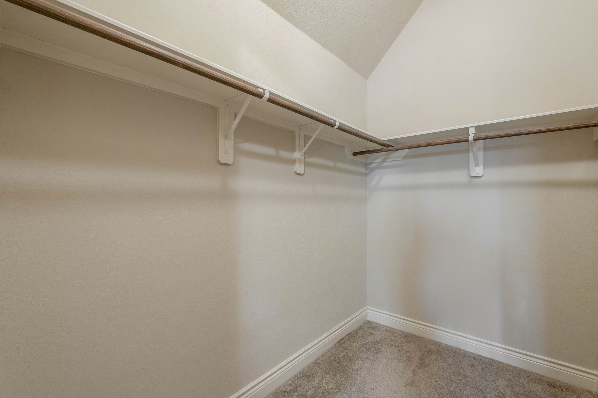 23306 Ridge Spring Drive New Caney, TX 77357 - Photo 32 of 45 a view of an empty walk in closet