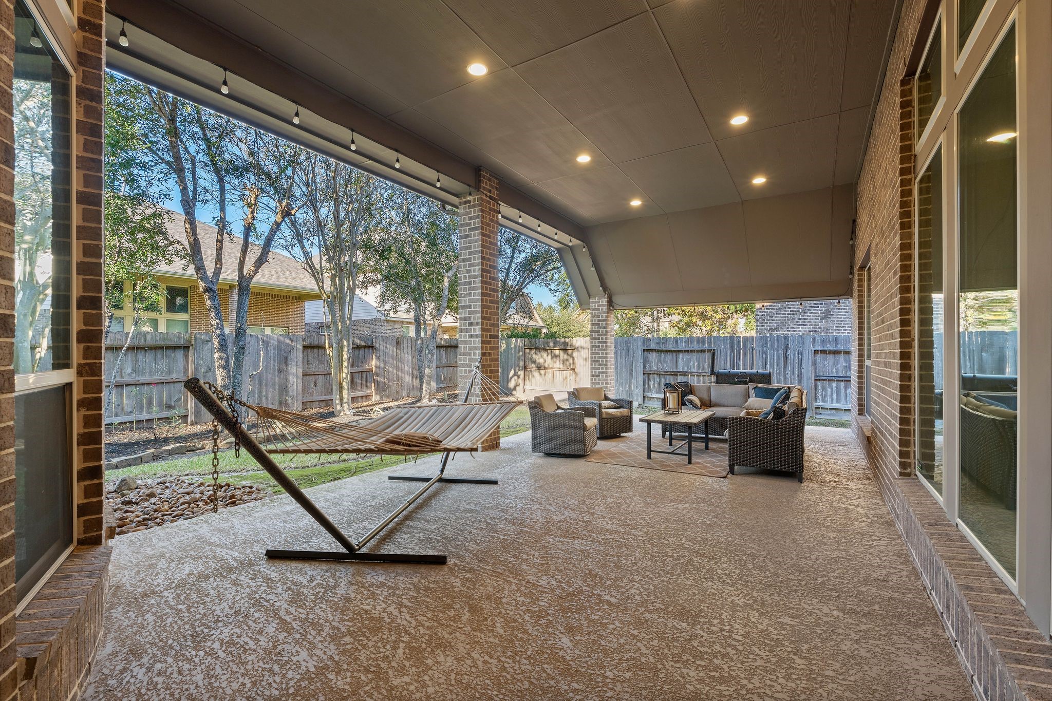 23306 Ridge Spring Drive New Caney, TX 77357 - Photo 35 of 45 a living room with furniture a table and a large window
