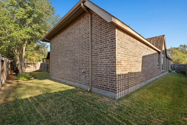 an aerial view of residential house with outdoor space and swimming pool