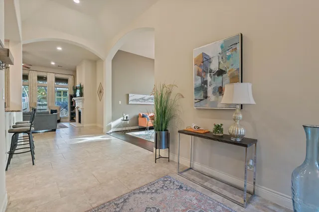 a kitchen with stainless steel appliances granite countertop a stove oven and a refrigerator