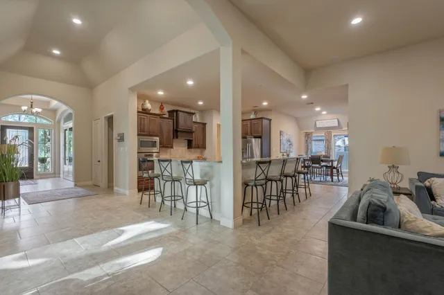 a kitchen with stainless steel appliances a sink stove and refrigerator