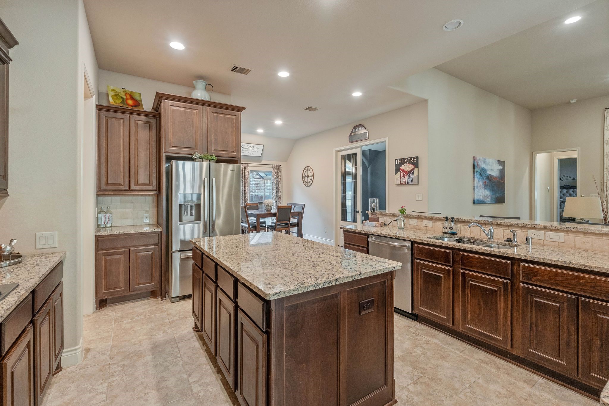 23306 Ridge Spring Drive New Caney, TX 77357 - Photo 8 of 45 a kitchen with stainless steel appliances a sink stove and refrigerator