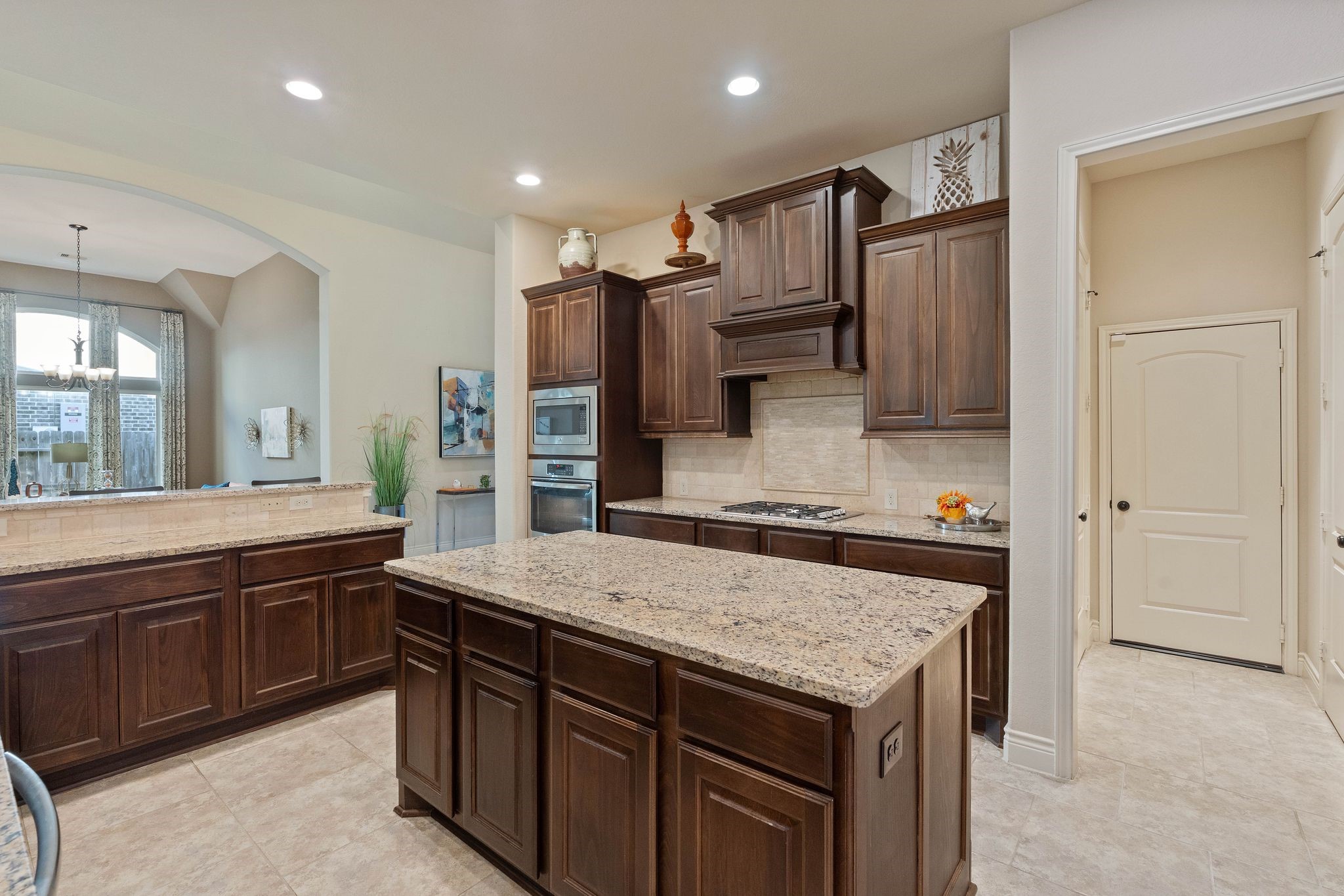 23306 Ridge Spring Drive New Caney, TX 77357 - Photo 10 of 45 a kitchen with a stove a refrigerator and a sink
