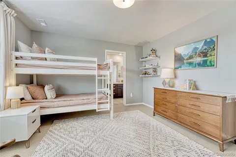 a bedroom with a bed and a cabinets