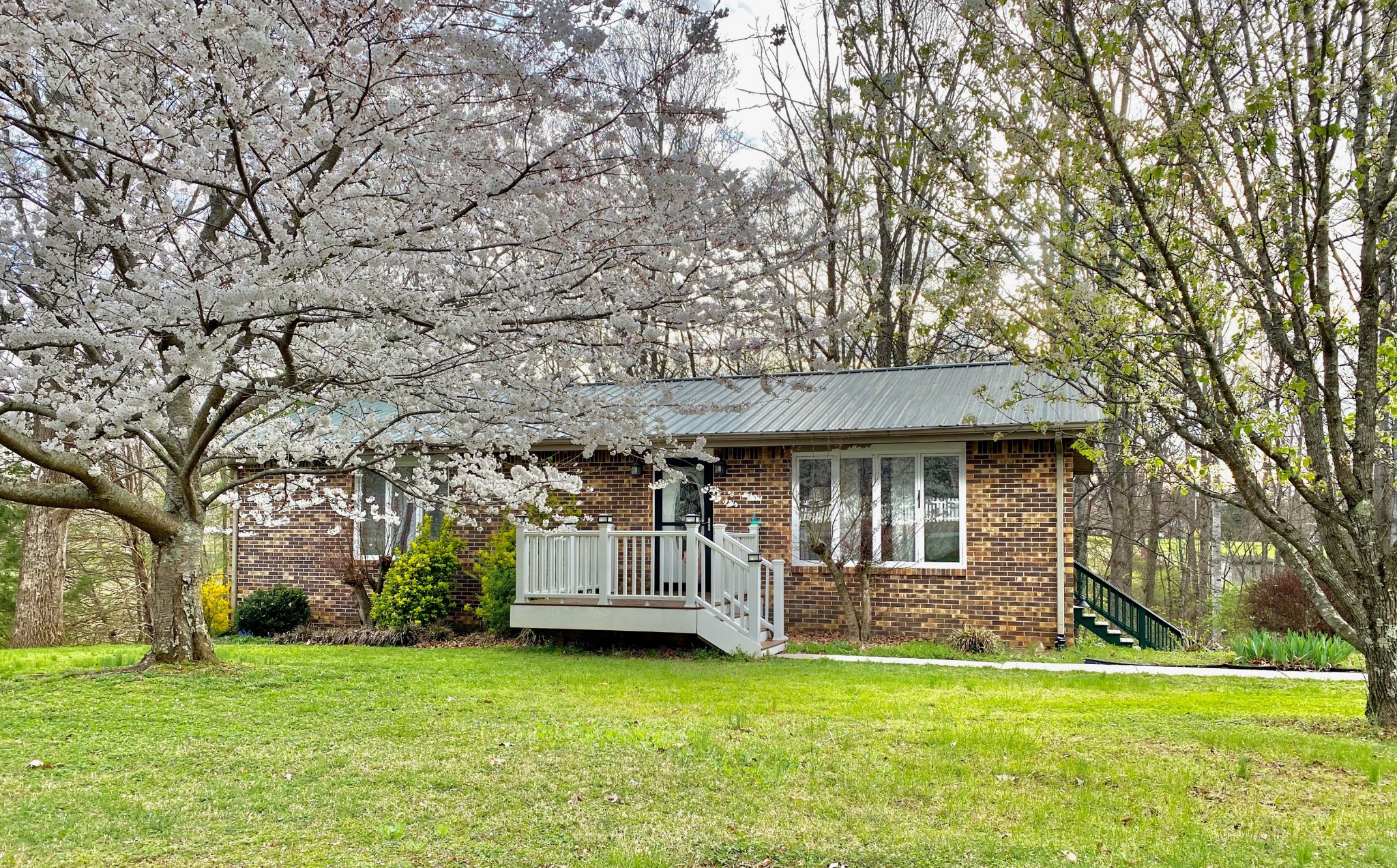 829 Dripping Springs Road Winchester, TN 37398 - Photo 1 of 32 a view of a house with backyard and a tree