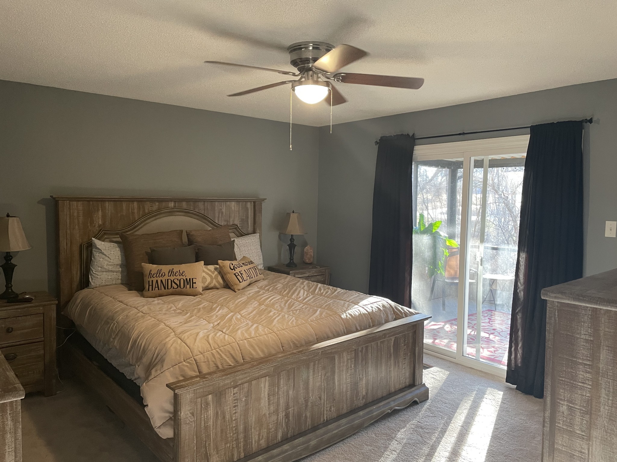 829 Dripping Springs Road Winchester, TN 37398 - Photo 12 of 32 a bedroom with a large bed and a chandelier