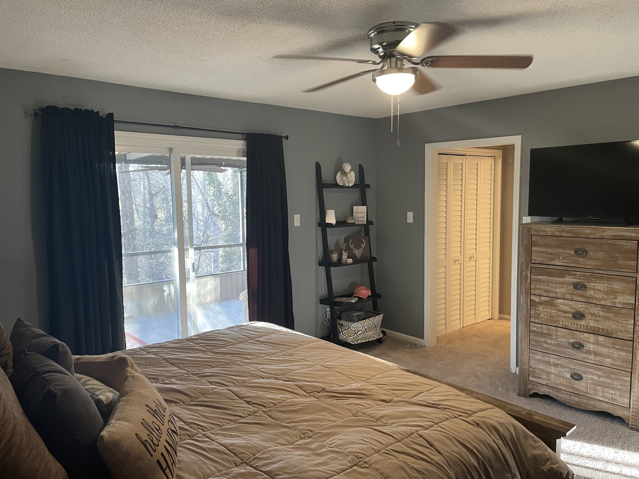 829 Dripping Springs Road Winchester, TN 37398 - Photo 13 of 32 a bedroom with a bed and a flat tv screen on dresser