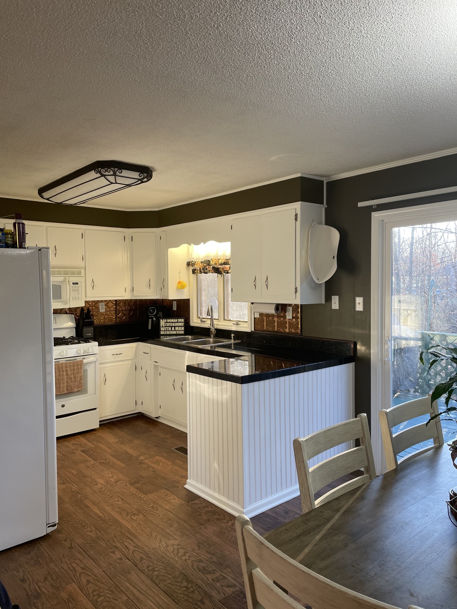 829 Dripping Springs Road Winchester, TN 37398 - Photo 24 of 32 a living room with stainless steel appliances kitchen island granite countertop furniture and a large window