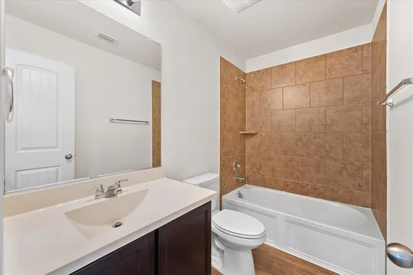 a bathroom with a sink a toilet and a bathtub