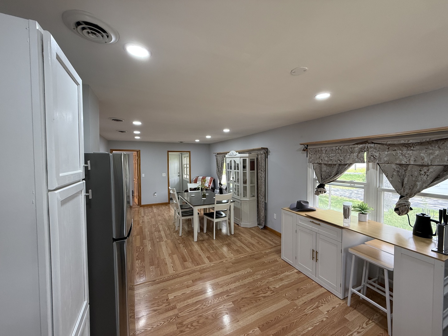 208 West Nippersink Road Round Lake, IL 60073 - Photo 4 of 32 a view of a kitchen with dining room and windows
