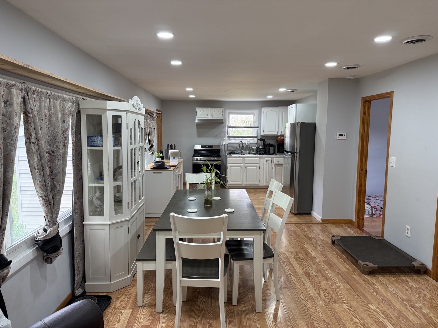 208 West Nippersink Road Round Lake, IL 60073 - Photo 5 of 32 a kitchen with stainless steel appliances granite countertop a refrigerator and a stove top oven