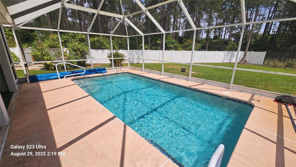 21 Lloleeta Path Palm Coast, FL 32164 - Photo 12 of 17 a view of yard with swimming pool