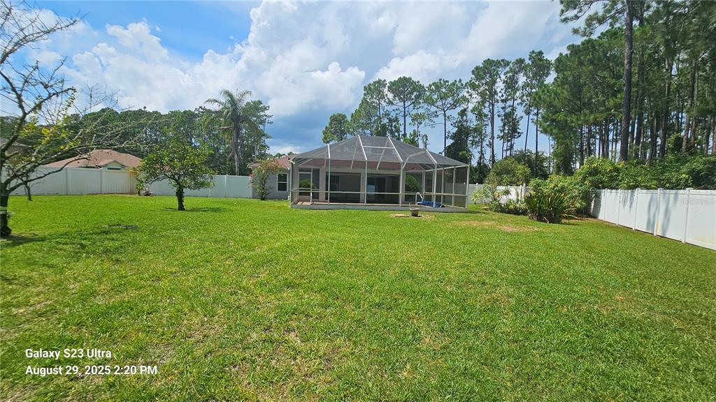 21 Lloleeta Path Palm Coast, FL 32164 - Photo 17 of 17 a view of a house with a yard and sitting area