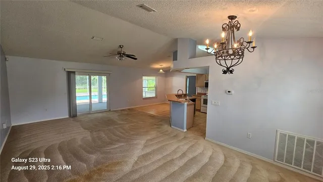 a view of a hallway with a chandelier