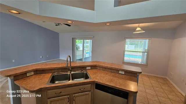 a kitchen with a sink and cabinets