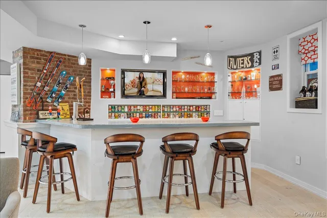 a group of chairs sitting in a kitchen and a kitchen