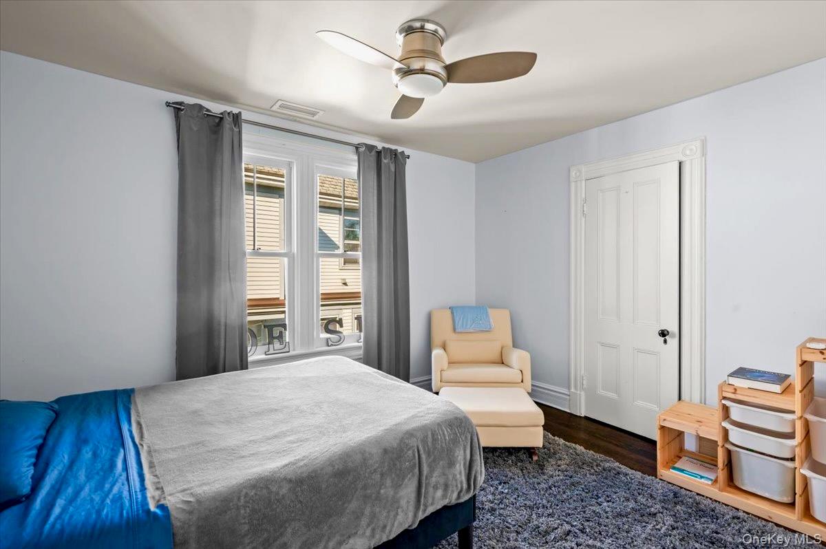 201 North Broadway Nyack, NY 10960 - Photo 26 of 36 a bedroom with a bed and wooden floor