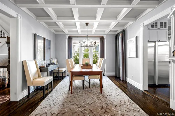 a living room with furniture a window and a table