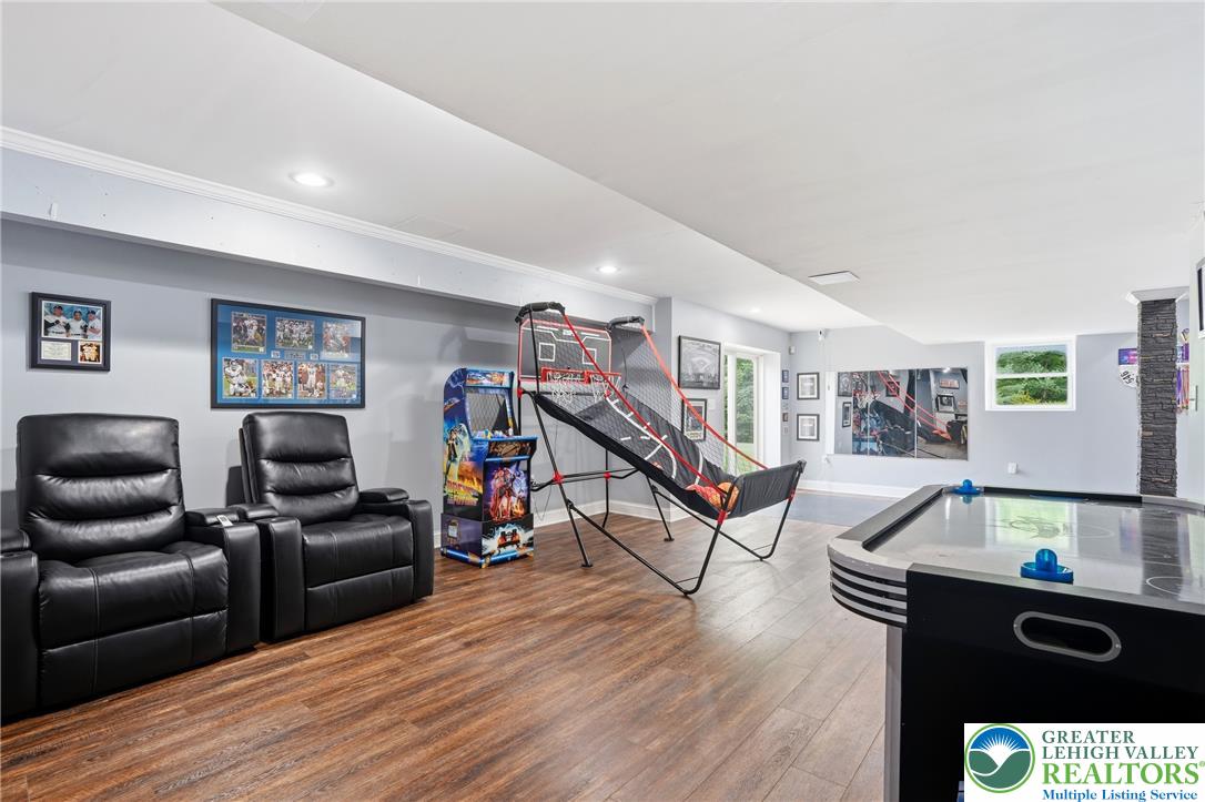 1212 Miller Road Wind Gap, PA 18091 - Photo 49 of 72 Recessed lighting illuminates this recreation room with durable wood flooring.