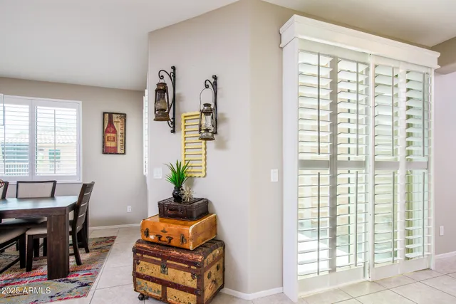 a kitchen with a refrigerator a stove a sink and a dining table