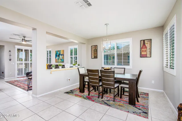 a view of a kitchen with kitchen island dining table and chairs