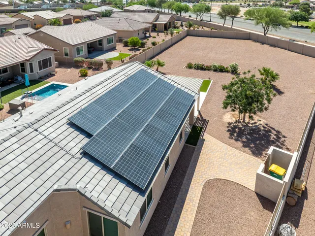 an aerial view of a house with a swimming pool