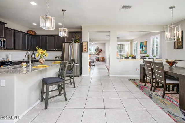 a kitchen with stainless steel appliances granite countertop a stove and a microwave