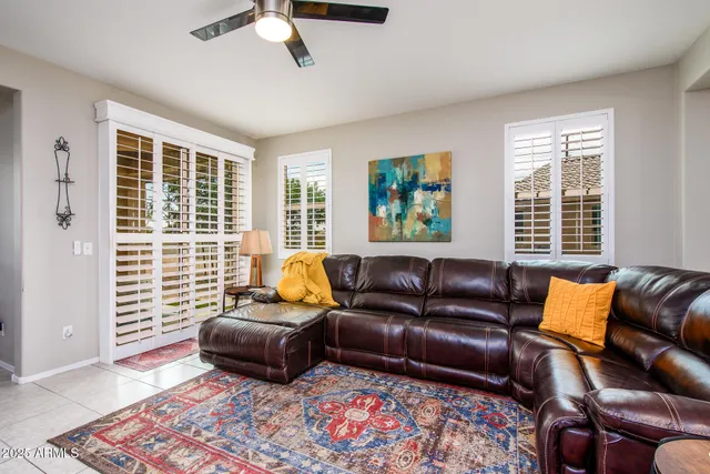 a bedroom with a bed couch and window
