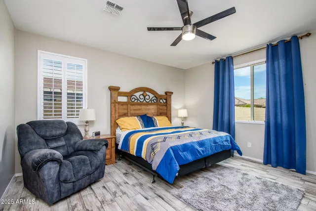 a large bathroom with a double vanity sink a mirror and a shower